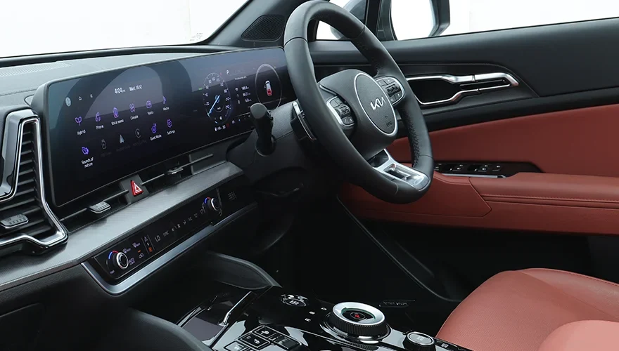 Kia Sportage L cockpit — dealership photograph; equipment varies by trim